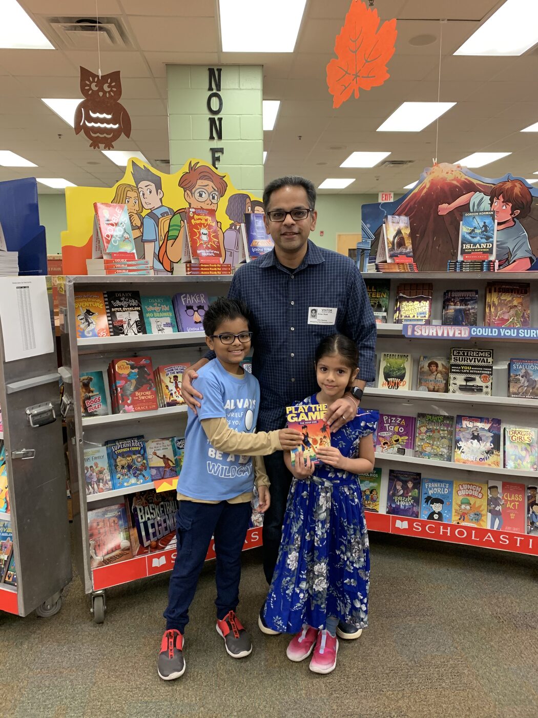 My kids at the Scholastic book fair — I write for them.
